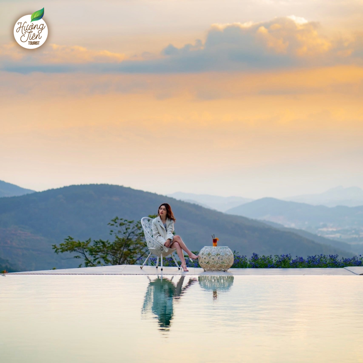 Visitor relaxing at a resort in Dalat with a mountain backdrop, showcasing peaceful experiences in the Dalat Land Tour