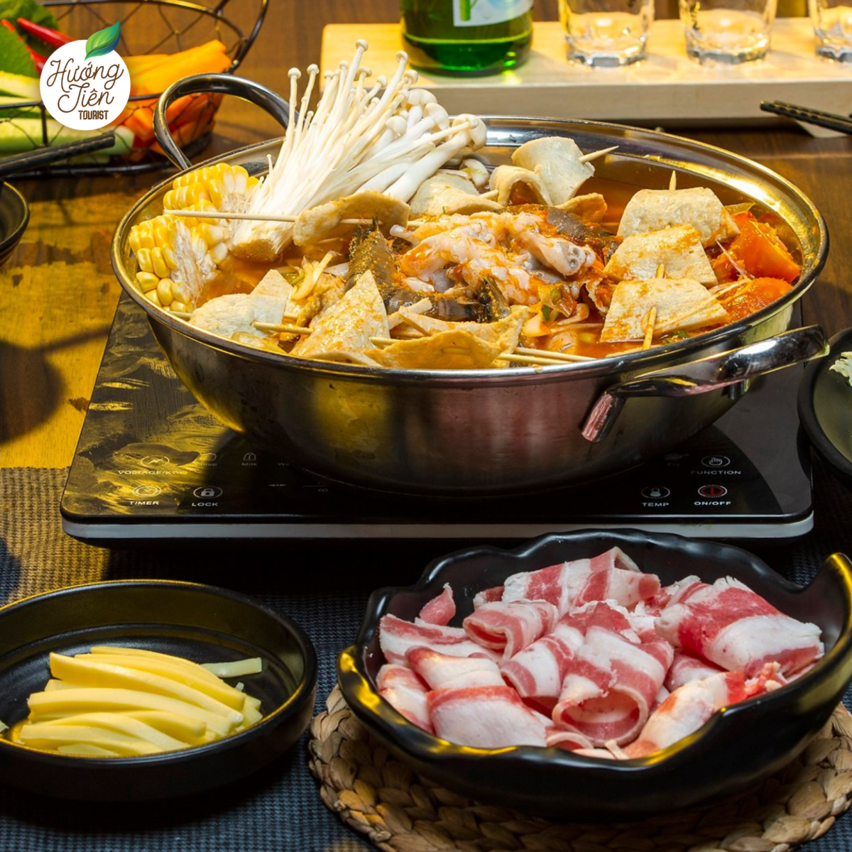 "Da Lat Land Tour hot pot and BBQ dinner featuring fresh ingredients and traditional Vietnamese flavors.