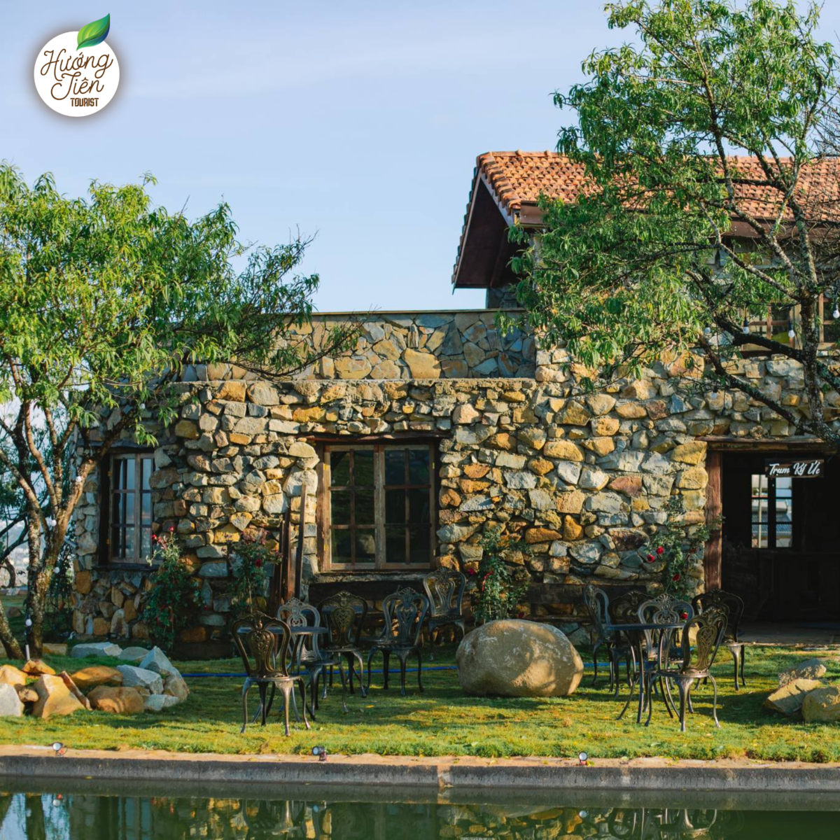 Memory Station Coffee Shop on the Da Lat Land Tour, offering a nostalgic ambiance with rustic stone architecture surrounded by scenic landscapes.