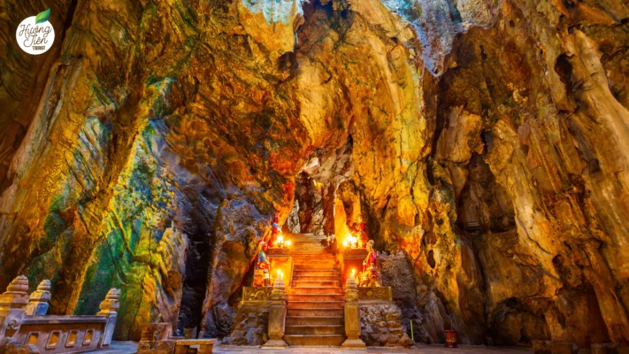 Sacred cave temple with intricate altars inside Marble Mountains, a popular cultural attraction in Da Nang, Vietnam.