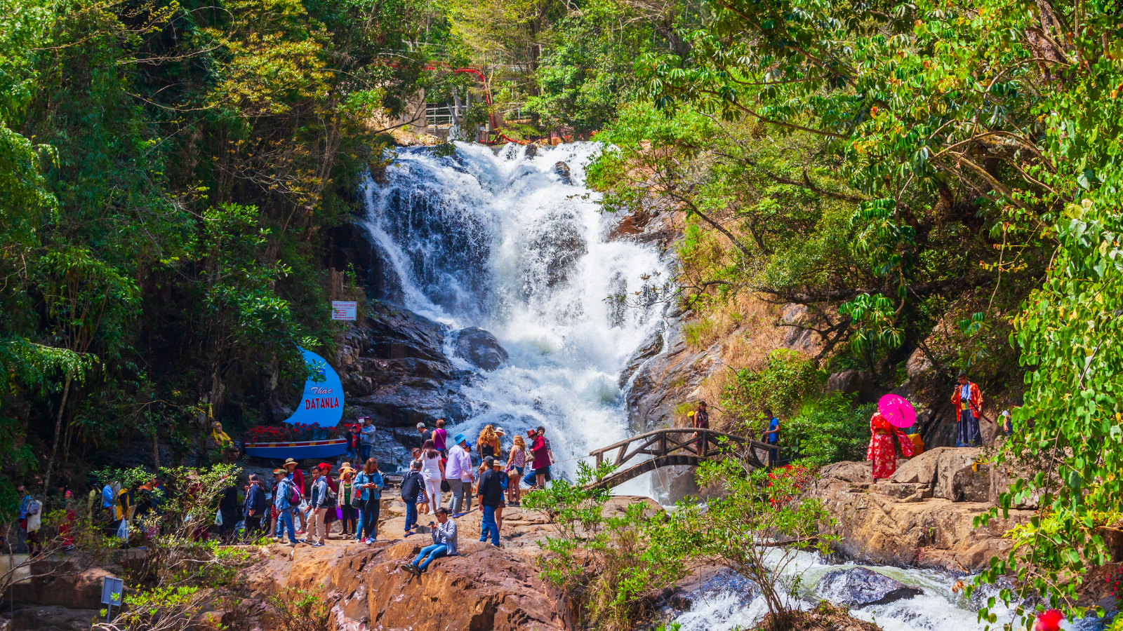Datanla Waterfalls in Da Lat, Vietnam, surrounded by lush greenery and forest scenery in land tour inbound Nha Trang