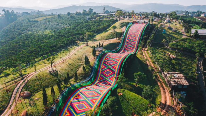 Mongo Land in Da Lat, Vietnam, with colorful grass slides and Mongolian-inspired yurts.