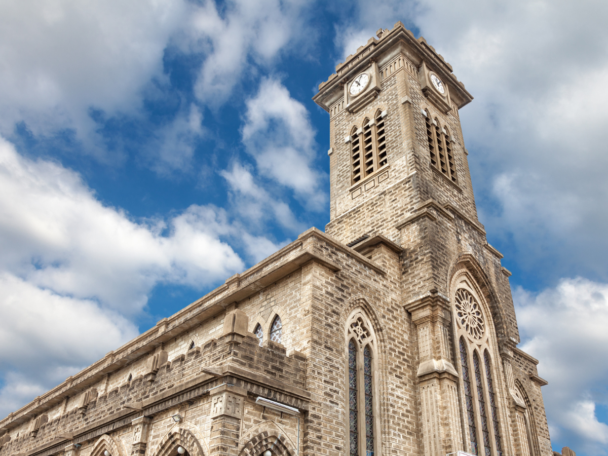 Historic Stone Church in Nha Trang, Vietnam, featuring French Gothic architecture.