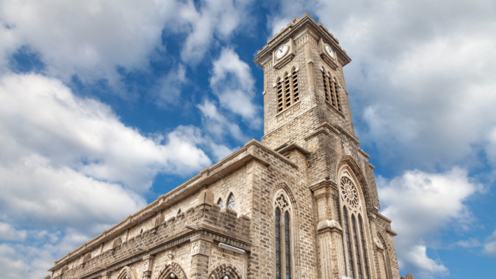 Historic Stone Church in Nha Trang, Vietnam, featuring French Gothic architecture.