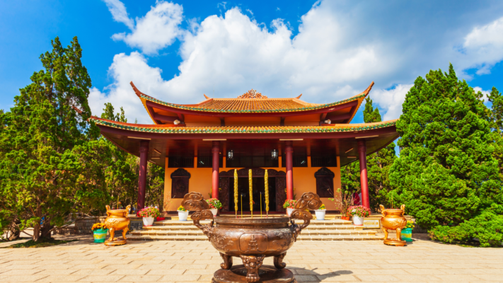 Truc Lam Zen Monastery in Da Lat, overlooking tranquil Tuyen Lam Lake and surrounded by pine forests.